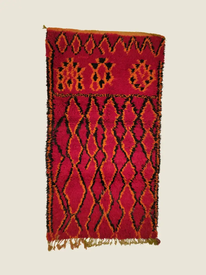 Vintage Beni M'guild rug 117×210cm, handwoven wool with deep rose red and earth-toned geometric bands.