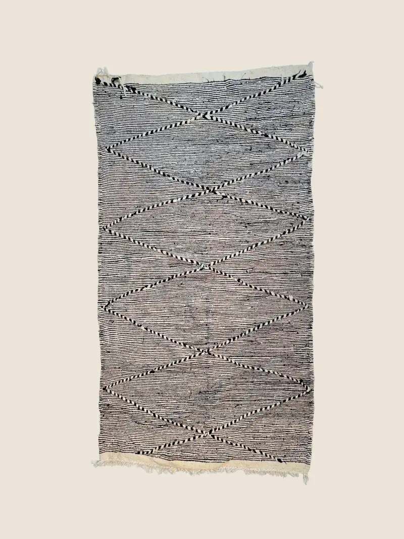 Boujad Rug 100×190cm, vintage handwoven berber rug with light and charcoal gray geometric patterns.