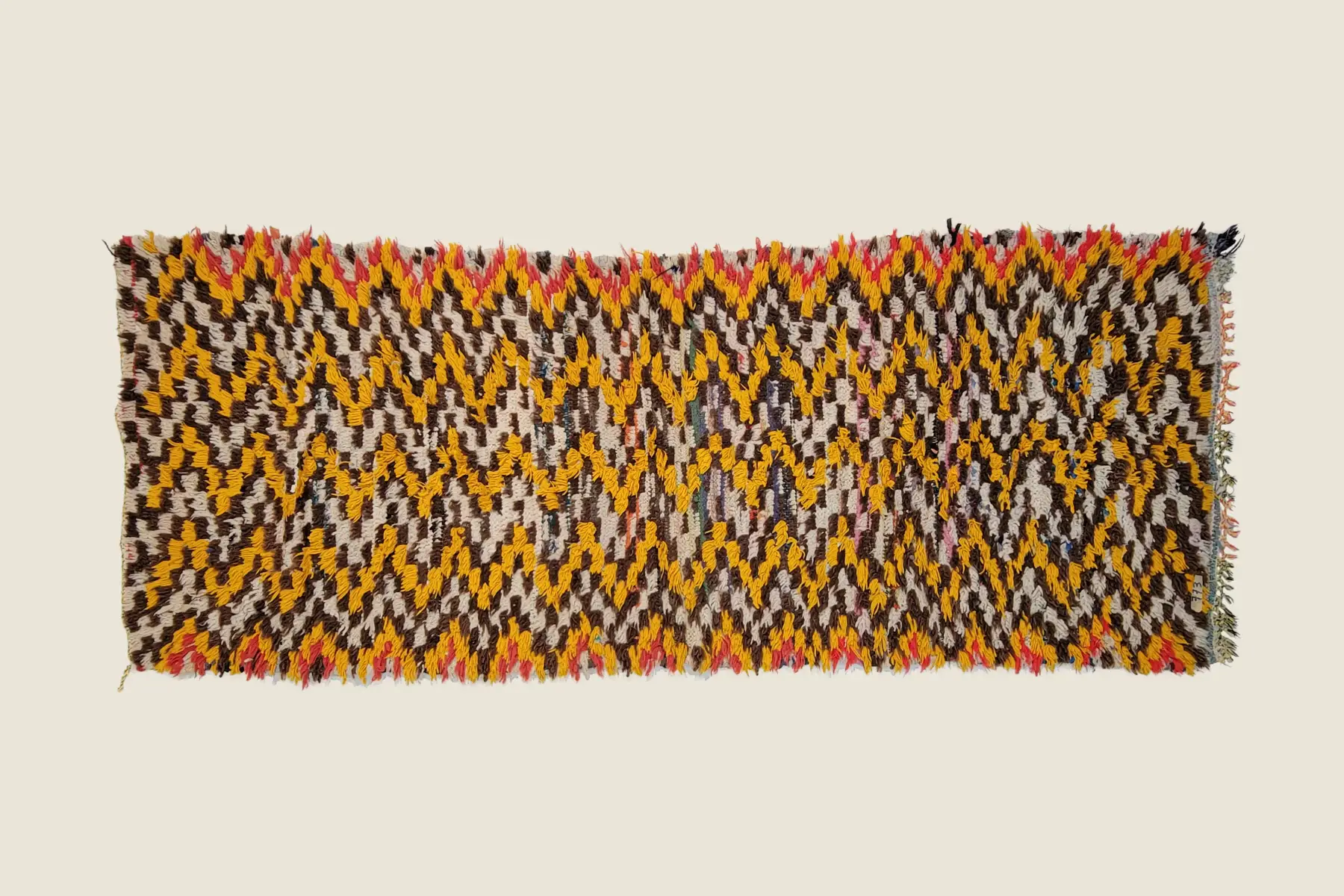 Azilal rug texture detail showing hand-spun wool and natural indigo dye craftsmanship