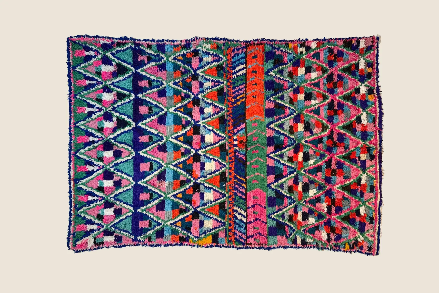 Azilal rug detail showing hand-spun wool texture and vibrant geometric pattern craftsmanship