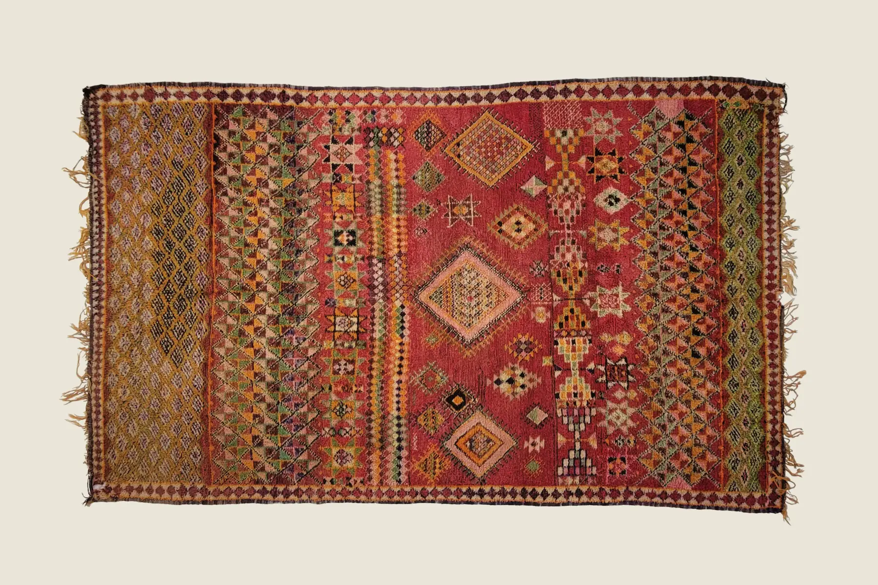 Azilal artisan rug detail showing vibrant orange and sage wool texture - hand-spun yarn craftsmanship.