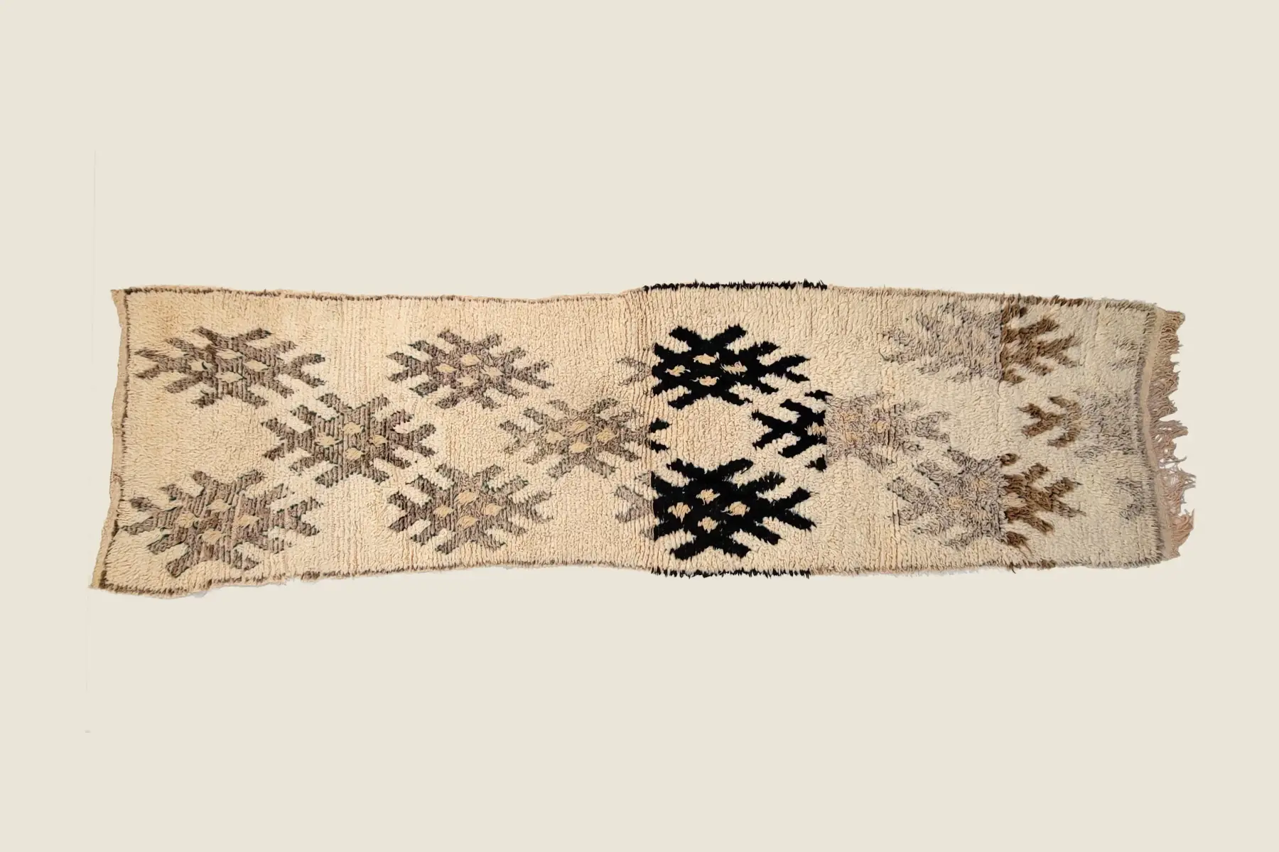 Beni M'Guild hand-knotted texture detail showing plush high-pile wool and charcoal geometric motifs