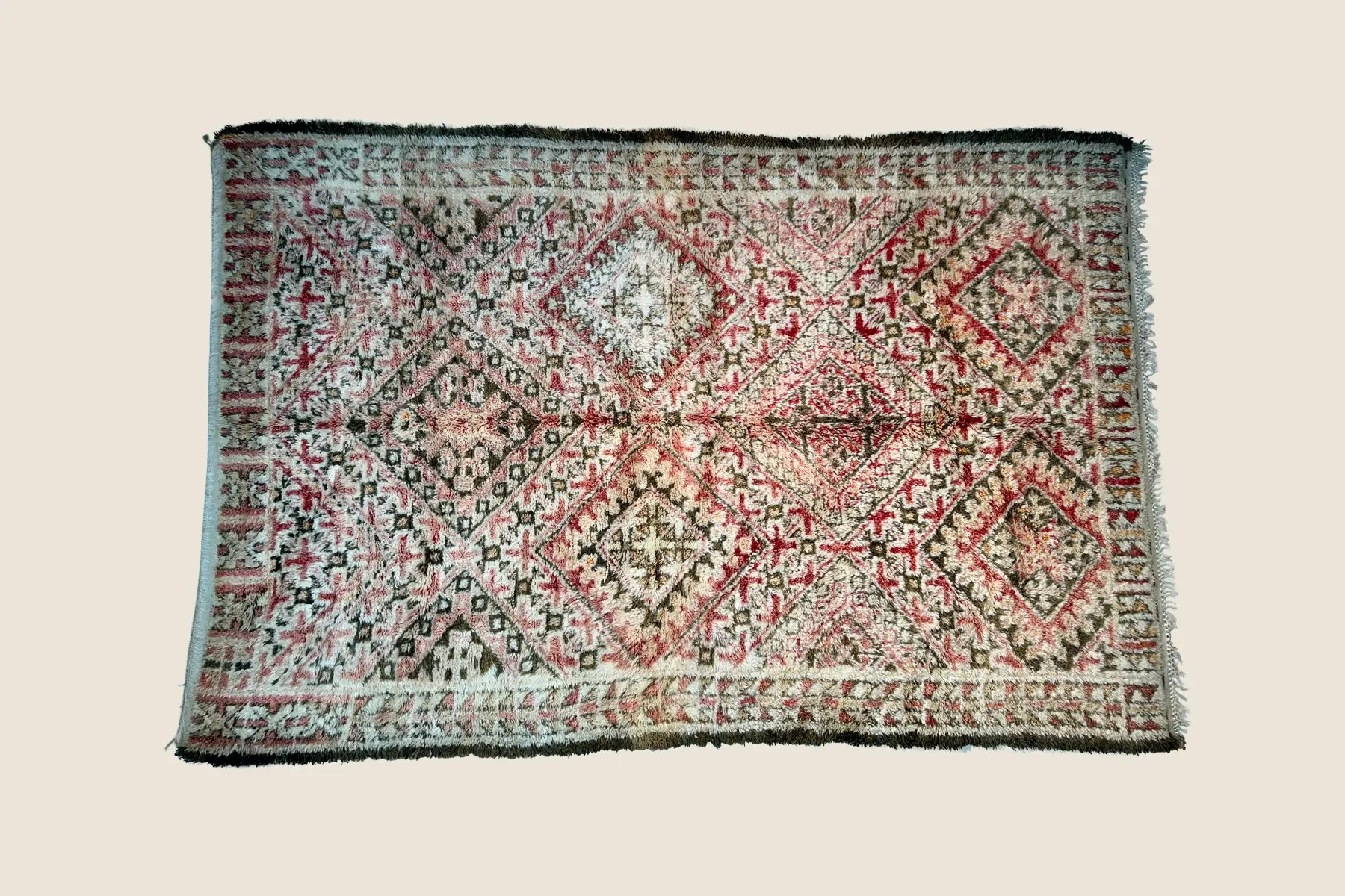 Beni M'Guild deep crimson wool texture showing hand-spun yarn and traditional knotting craftsmanship