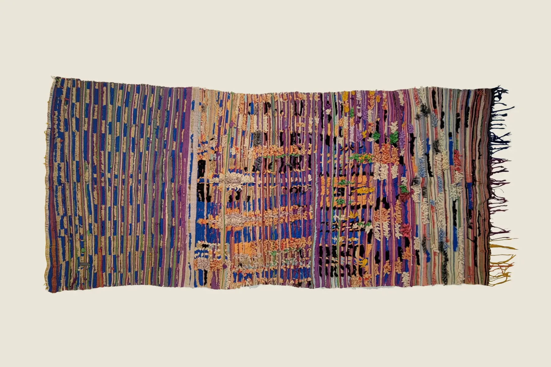 Boucherouite recycled textile detail showing serene blue and sage green tufts - hand-crafted shag texture.