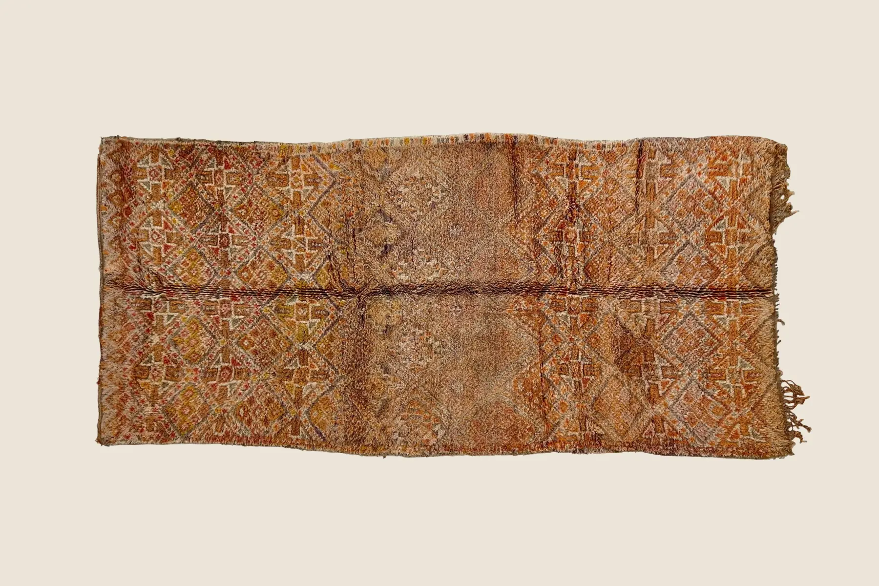 Marmoucha rug texture detail showing hand-knotted wool pile in warm orange, beige & brown stripes