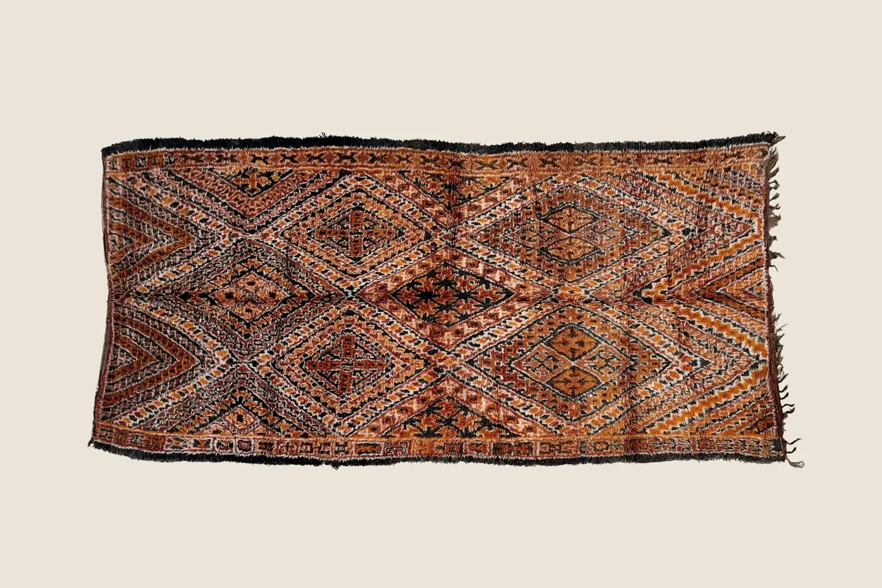 Marmoucha wool texture detail showing hand-knotted orange, brown & gray pile craftsmanship