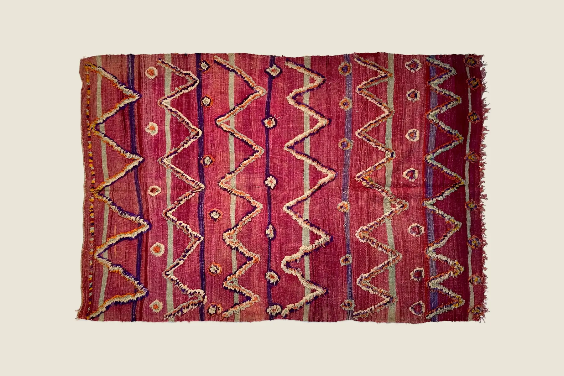 Talsint rug deep plum pile texture showing hand-spun wool craftsmanship and knotting detail