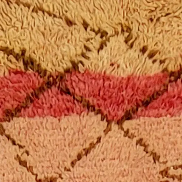 A rug with a gradient from brick red to a lighter red