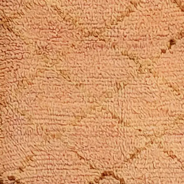 Warm terracotta orange color swatch from an Azilal rug.