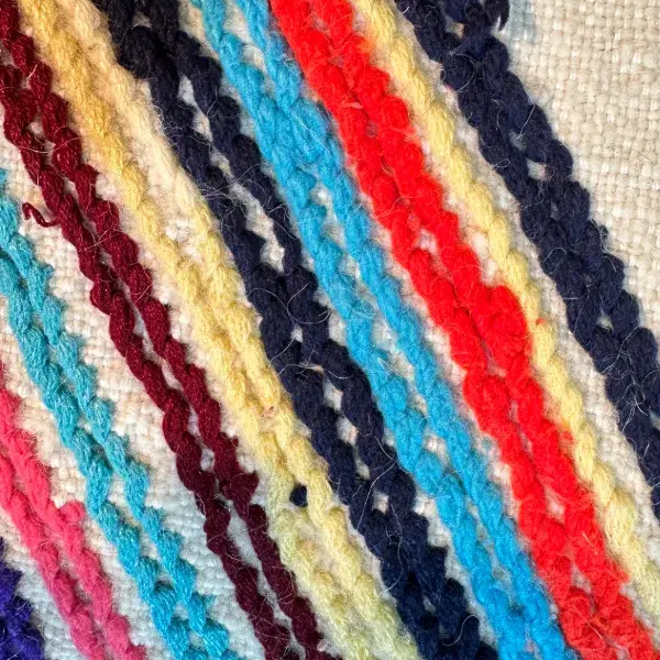 Light teal blue diamond pattern on a minimalist rug