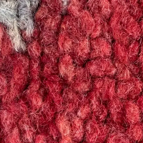 Dark red color swatch from a Beni M'guild rug, featuring warm beige and pink tones.