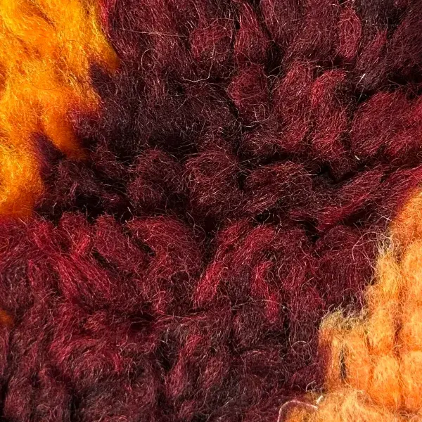 Dark red-brown diamond symbol on a color swatch.