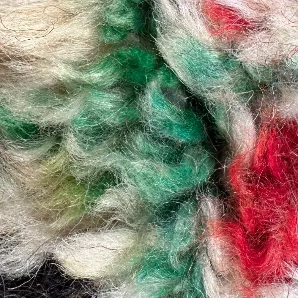 A medium teal green diamond symbol.