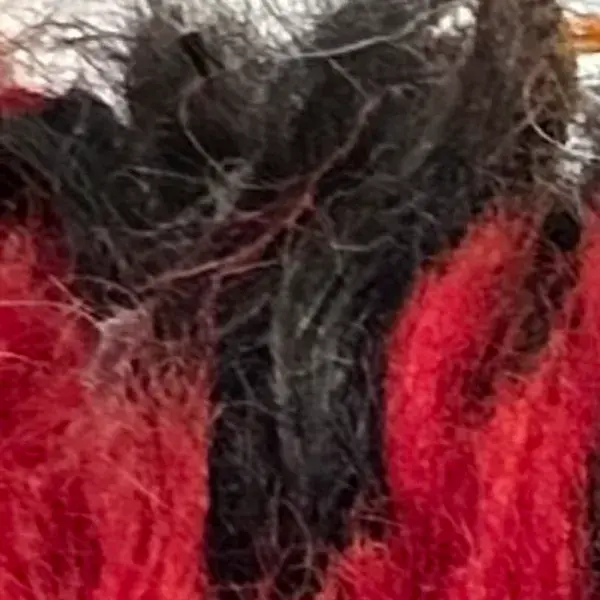 Diamond symbol in charcoal brown, a shade of red.