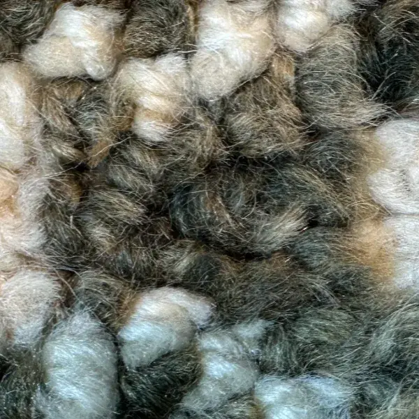 Dark orange diamond symbol on a warm gray background