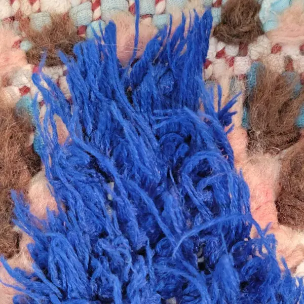 A medium blue fabric swatch labeled bouchrwit.