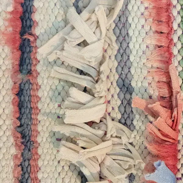 A light warm gray color swatch for the orange family of the Chichaoua rug in Serene Blue and Beige