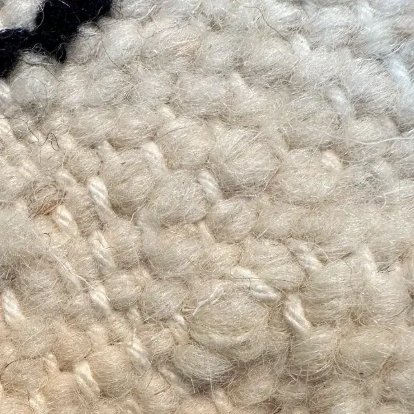 A light warm gray zigzag pattern on an orange background.