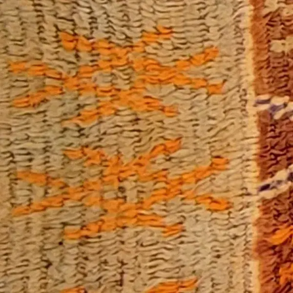 Close-up of a deep amber brown wool fiber from a Boujad rug.