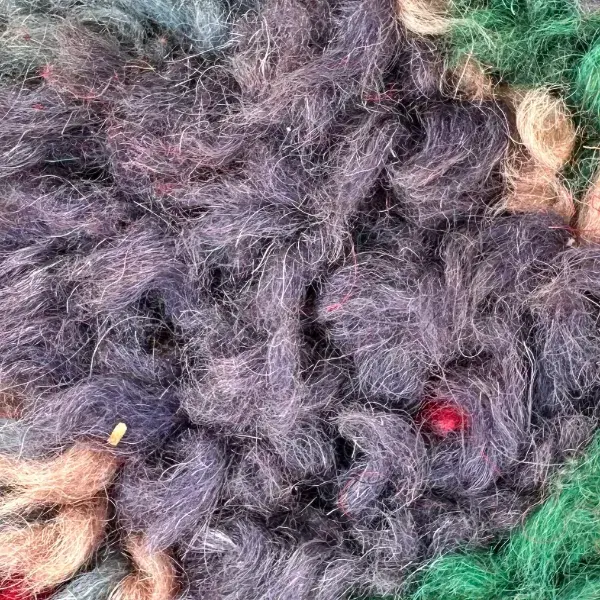A color swatch labeled "Boujad" showing a medium grayish purple shade from the purple color family.