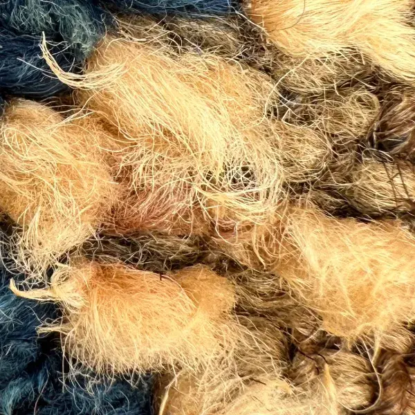 A color swatch labeled "Warm Beige" from the orange family, featuring the Beni Mguild product.