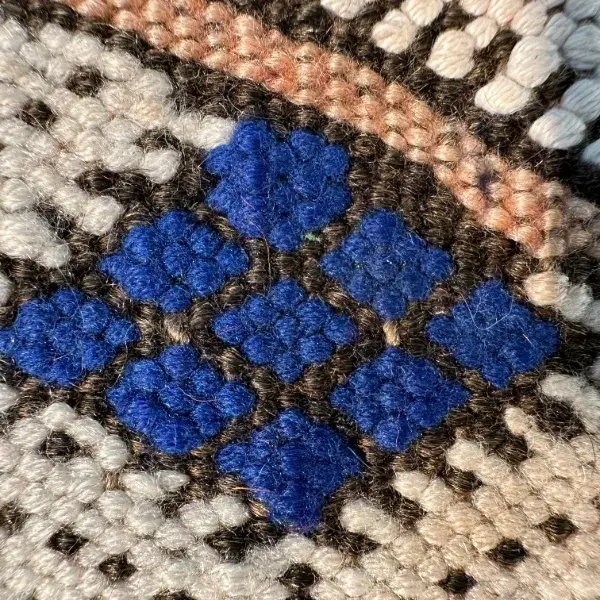 Dark blue diamond symbol on a deep navy background.