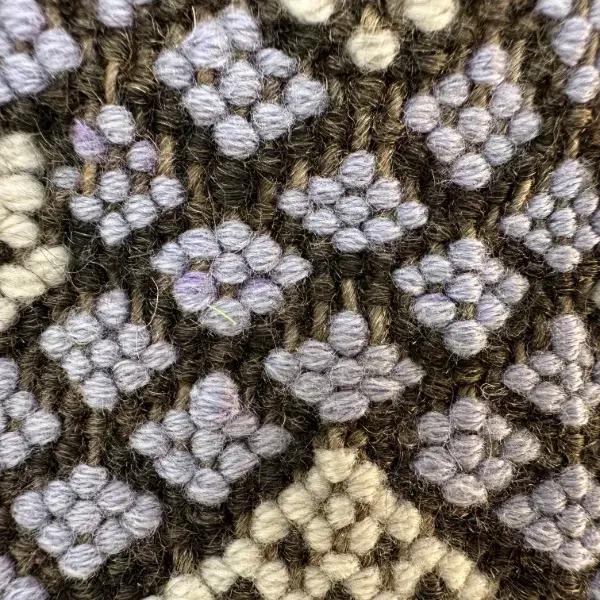 Light gray-lavender diamond symbol on a purple color swatch.