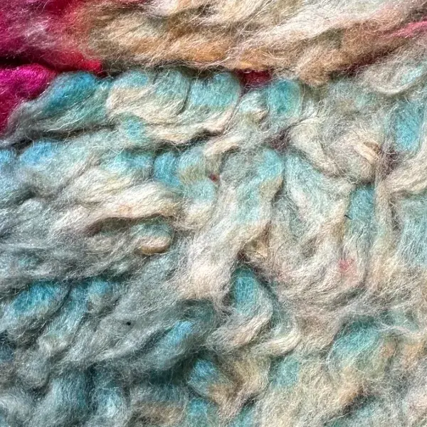 A light teal gray diamond shape on a blue background.