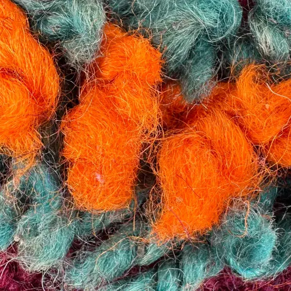 A warm orange color swatch from the earth-tones family.