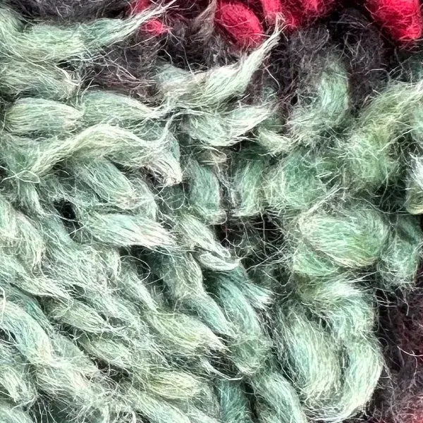 A light gray color swatch from the green family, part of the Talsint product line.