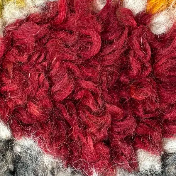 A deep red color swatch from the Talsint product line, labeled Deep Red.