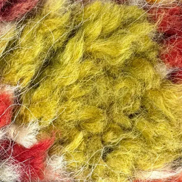 A color swatch labeled Warm Olive from the Talsint product line, showing a muted yellow-green shade.