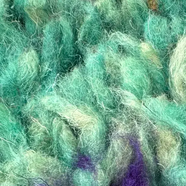 A color swatch of medium sage green, a muted green with gray undertones, labeled TALSINT.